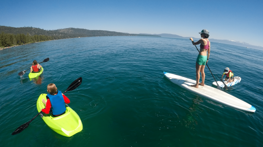 family paddle boarding and kayaking in lake tahoe