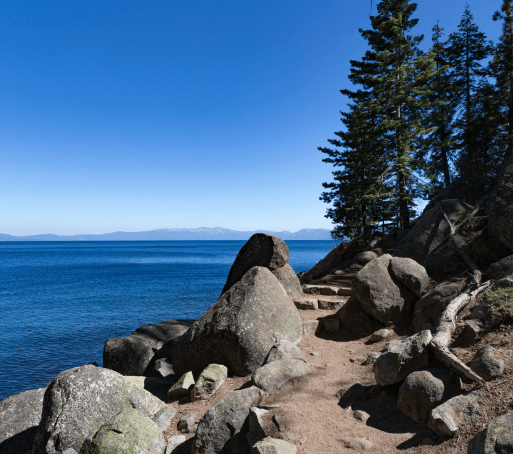 popular flume bike trail with large boulders next to Lake Tahoe